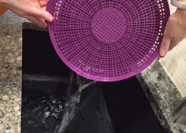 The Ultradrainer empyting water into a sink