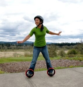 A young woman using Orbitwheels